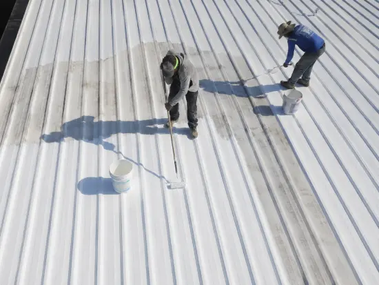 Crew Applying Coating on Sunny Day